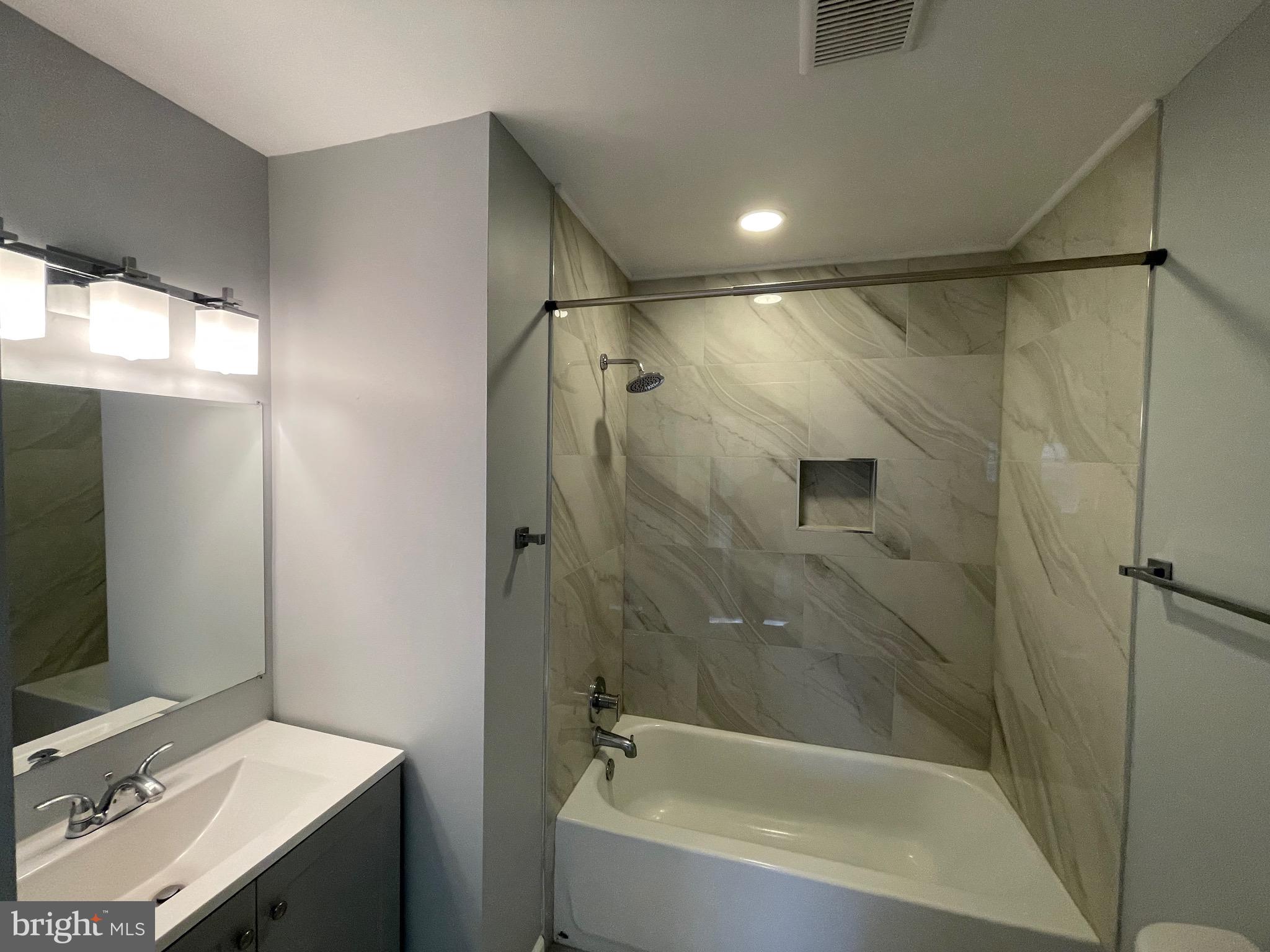 229 Garner Avenue Waldorf, MD 20602 - Photo 15 of 25 a bathroom with a sink mirror toilet and bathtub
