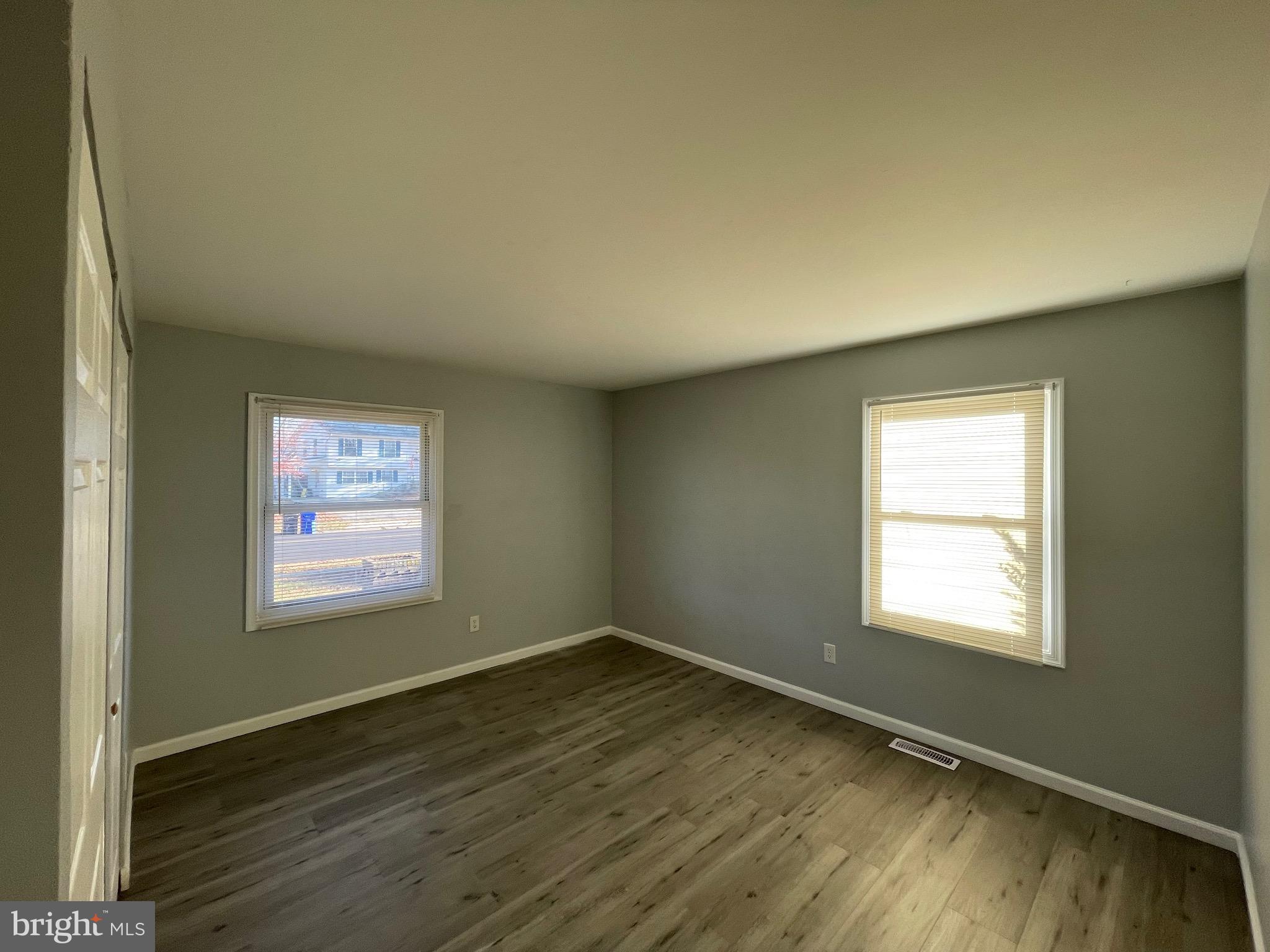 229 Garner Avenue Waldorf, MD 20602 - Photo 17 of 25 a view of an empty room with wooden floor and a window