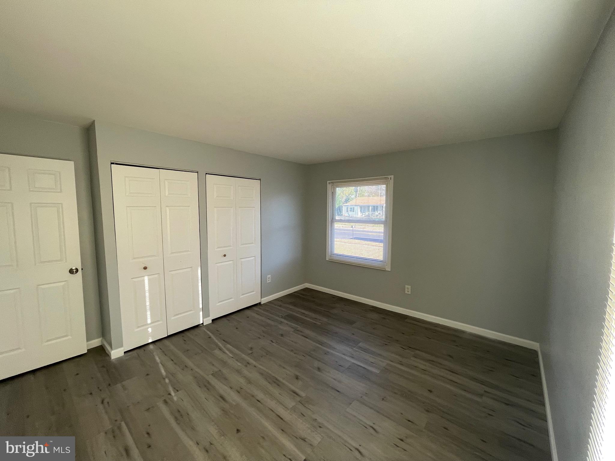 229 Garner Avenue Waldorf, MD 20602 - Photo 18 of 25 a view of an empty room with wooden floor and a window