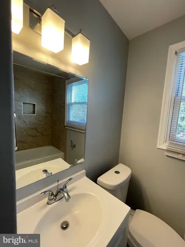 an empty room with a empty space and windows