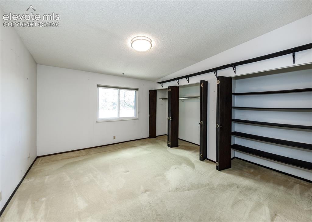 1034 Fontmore Road, Unit D Colorado Springs, CO 80904 - Photo 21 of 43 an empty room with windows