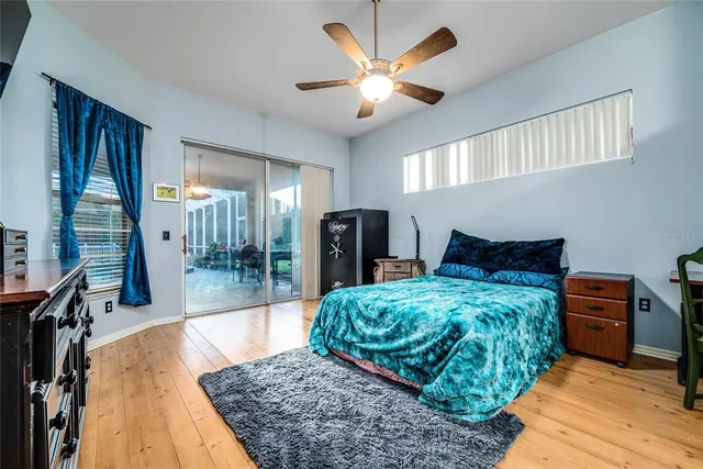 a bathroom with a double vanity sink a tub and a mirror