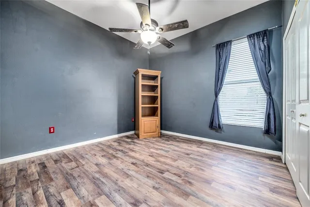 an aerial view of a house with outdoor space and a lake view