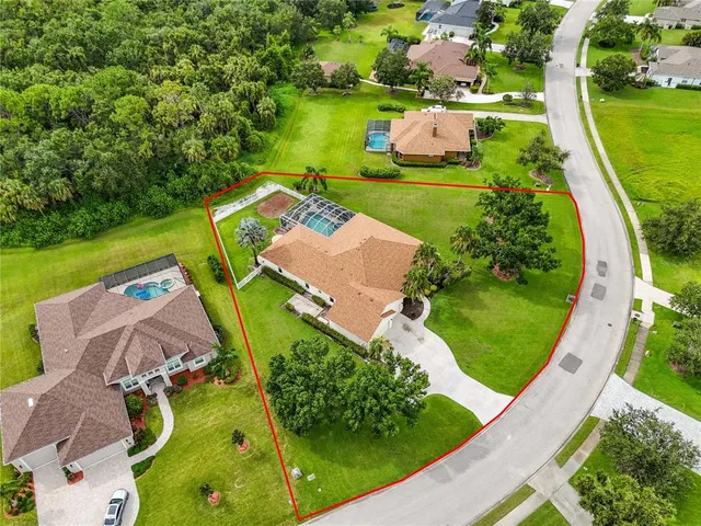 an aerial view of a house with a garden