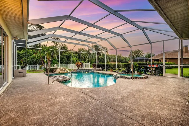 a view of a swimming pool with a patio