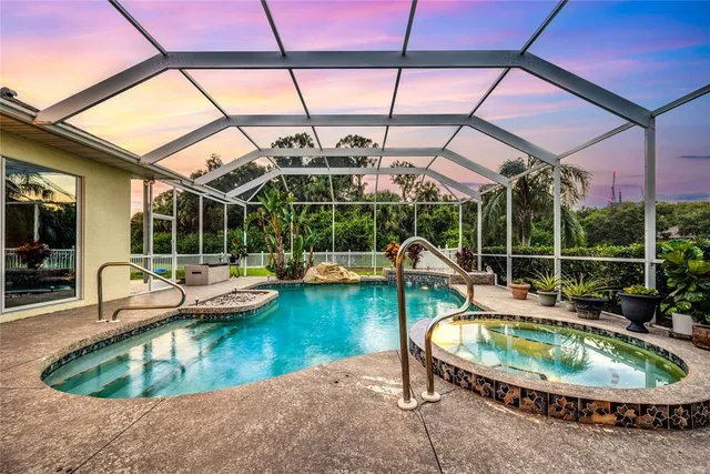 a view of a swimming pool with a patio