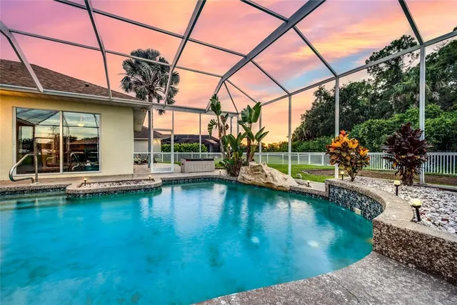 a view of a swimming pool with a patio