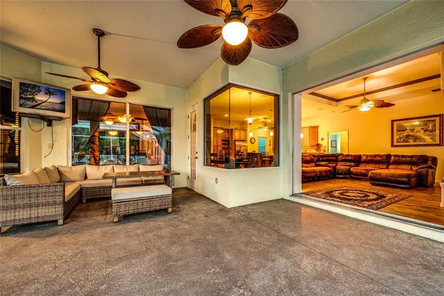 a view of a livingroom with furniture and a flat screen tv