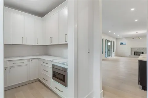 a view of a kitchen with electric appliances