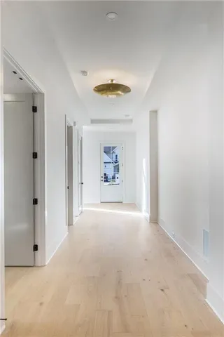 a view of an empty room and a window