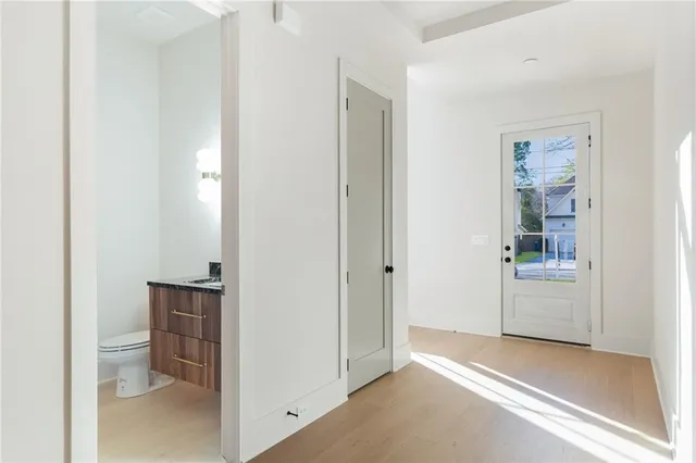 a room with a bench and a hallway