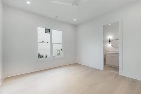 an empty room with a empty space and windows