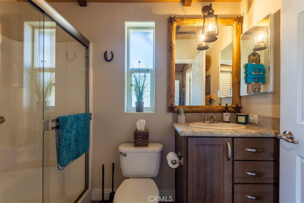 30415 Chihuahua Valley Road Warner Springs, CA 92086 - Photo 12 of 75 a bathroom with a granite countertop sink toilet and shower