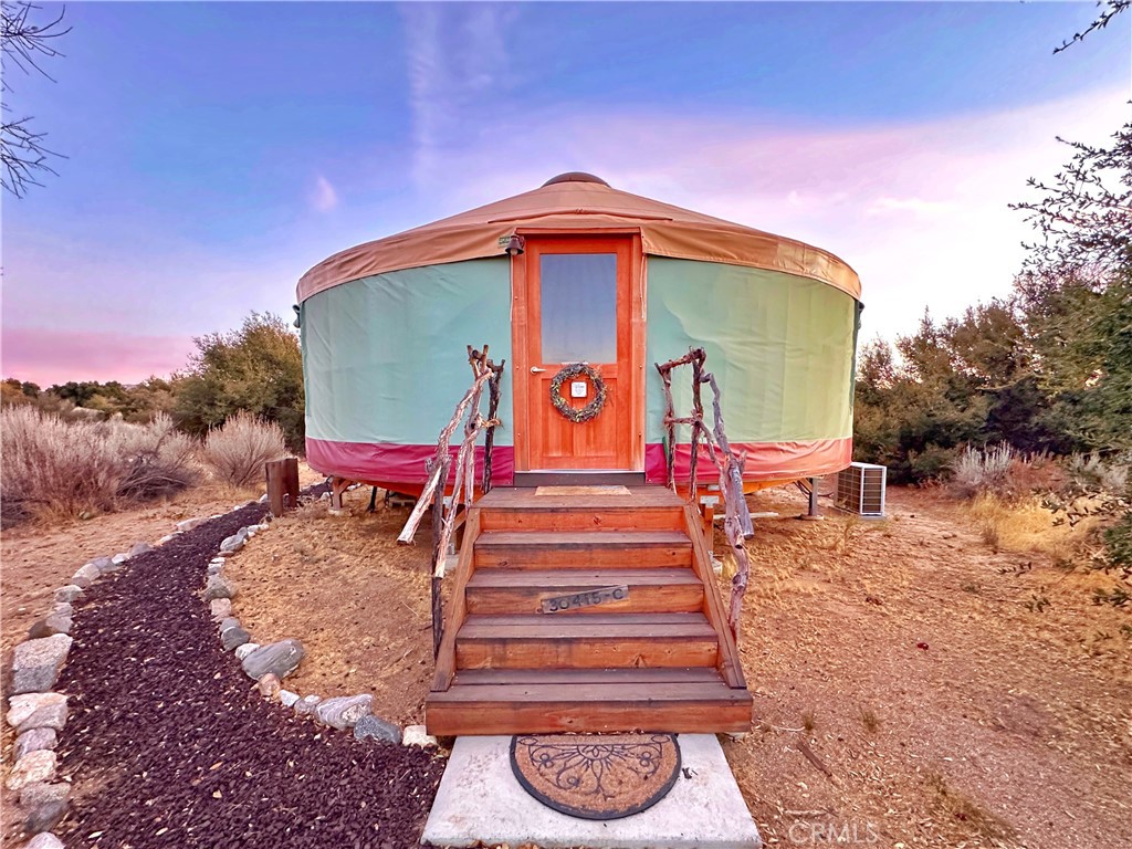 30415 Chihuahua Valley Road Warner Springs, CA 92086 - Photo 36 of 75 a view of a small house in the middle of a yard