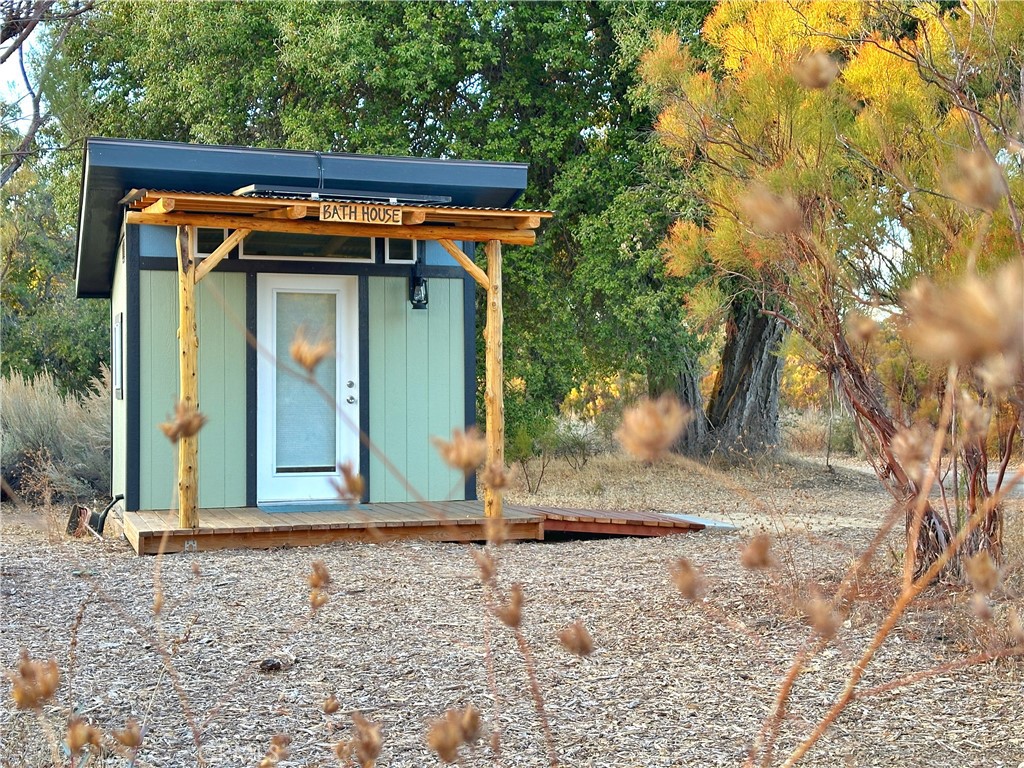30415 Chihuahua Valley Road Warner Springs, CA 92086 - Photo 48 of 75 a view of a wooden house with large trees