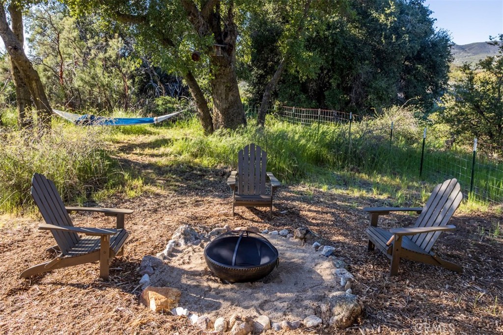 30415 Chihuahua Valley Road Warner Springs, CA 92086 - Photo 60 of 75 a view of a chairs and table in backyard