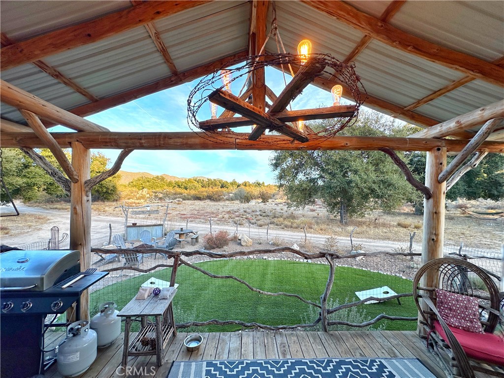 30415 Chihuahua Valley Road Warner Springs, CA 92086 - Photo 6 of 75 a view of a porch with furniture and a yard