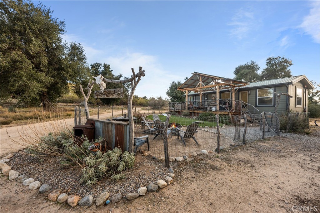 30415 Chihuahua Valley Road Warner Springs, CA 92086 - Photo 74 of 75 a view of a chairs and table in the backyard