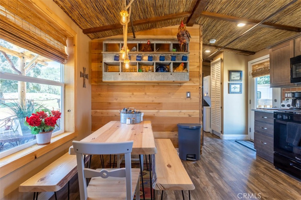 30415 Chihuahua Valley Road Warner Springs, CA 92086 - Photo 8 of 75 a dining room with furniture a chandelier and wooden floor