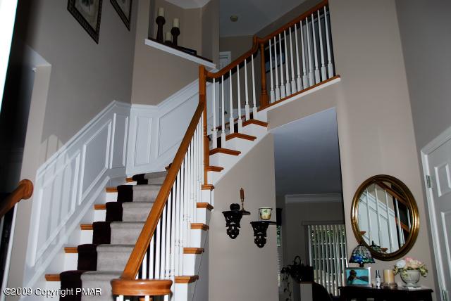 103 Kelly Road Stroudsburg, PA 18360 - Photo 11 of 19 a view of staircase with wooden floor and white walls