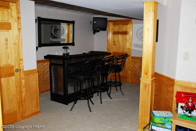 103 Kelly Road Stroudsburg, PA 18360 - Photo 15 of 19 a living room with furniture and a flat screen tv
