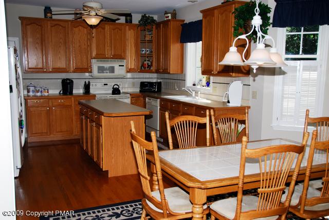103 Kelly Road Stroudsburg, PA 18360 - Photo 7 of 19 a kitchen with stainless steel appliances granite countertop a stove a sink and a refrigerator