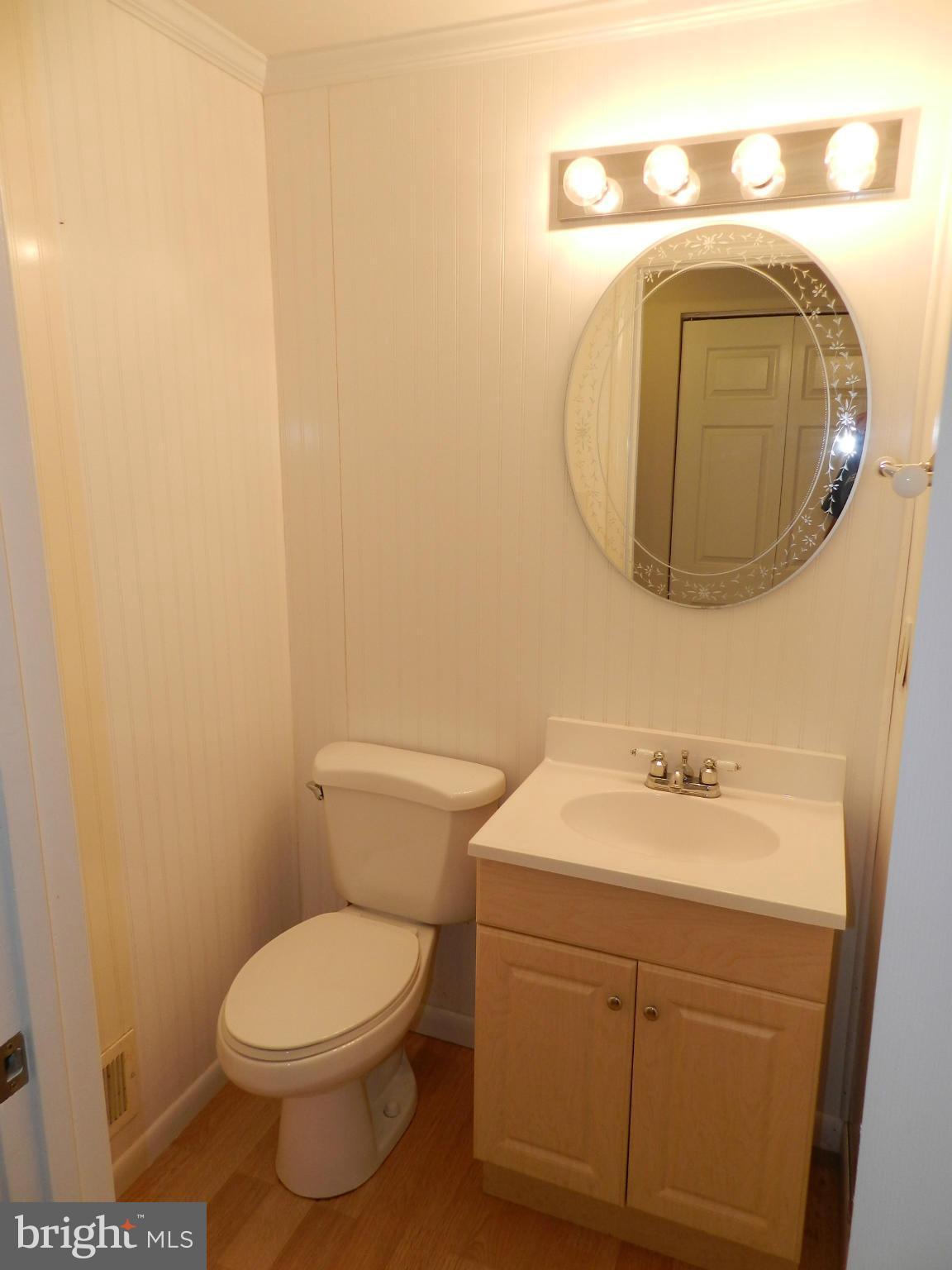 17567 Kohlhoss Road Poolesville, MD 20837 - Photo 14 of 25 a bathroom with a sink and mirror