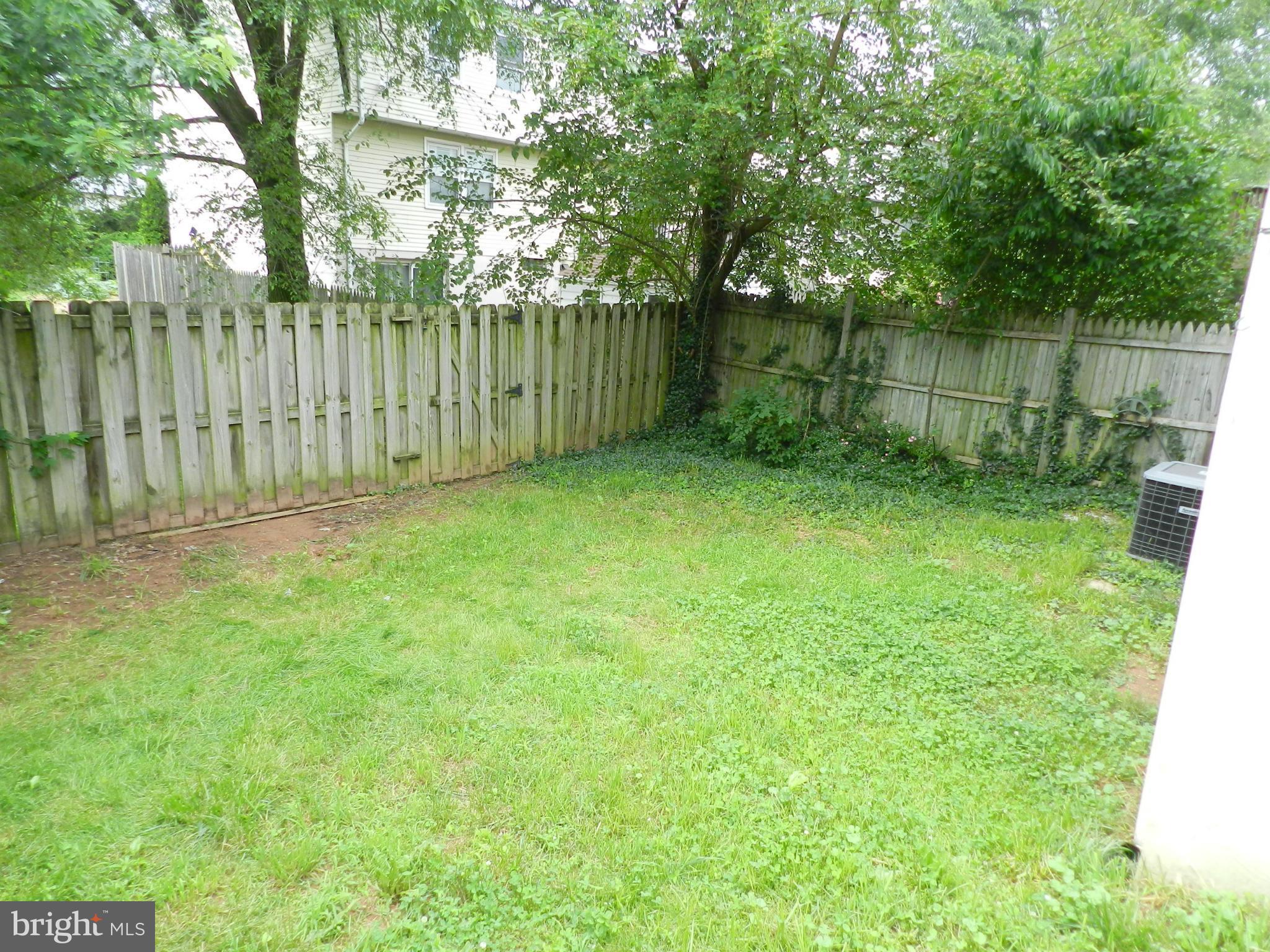 17567 Kohlhoss Road Poolesville, MD 20837 - Photo 7 of 25 a view of a backyard with a trees and plants