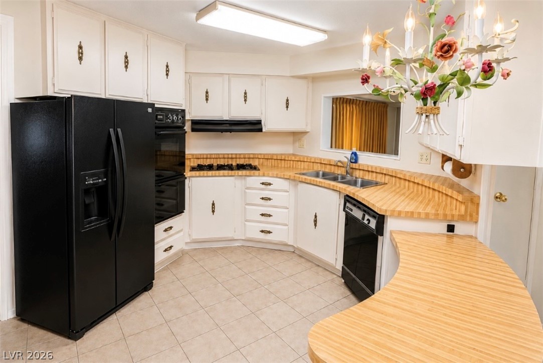 4556 Royal Ridge Way Las Vegas, NV 89103 - Photo 8 of 49 Ample counter space and classic cabinetry define this functional kitchen layout.