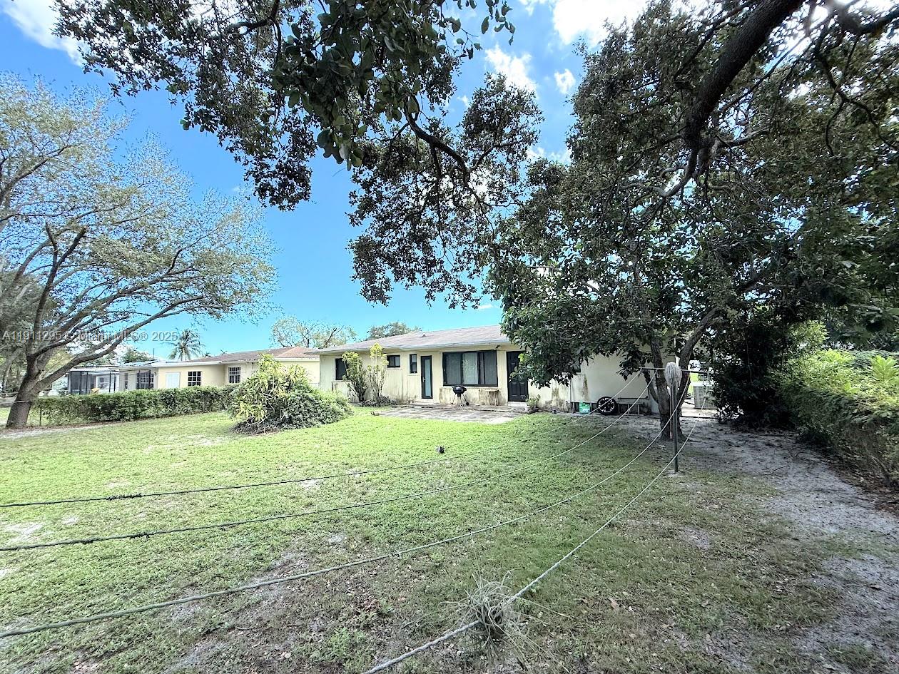 1041 Northwest 150th Street Miami, FL 33168 - Photo 23 of 27 a house view with a garden space