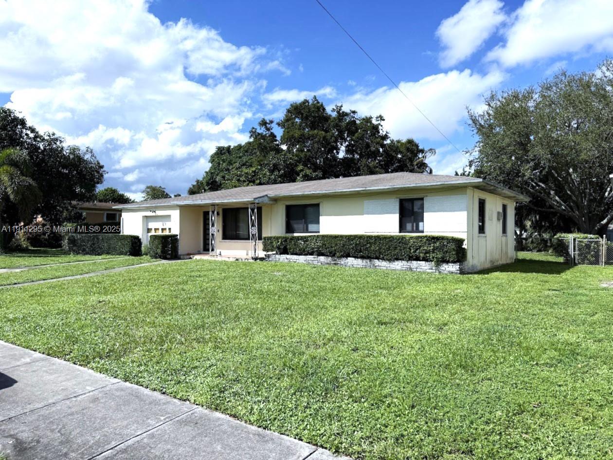 1041 Northwest 150th Street Miami, FL 33168 - Photo 3 of 27 a view of a house with backyard and garden