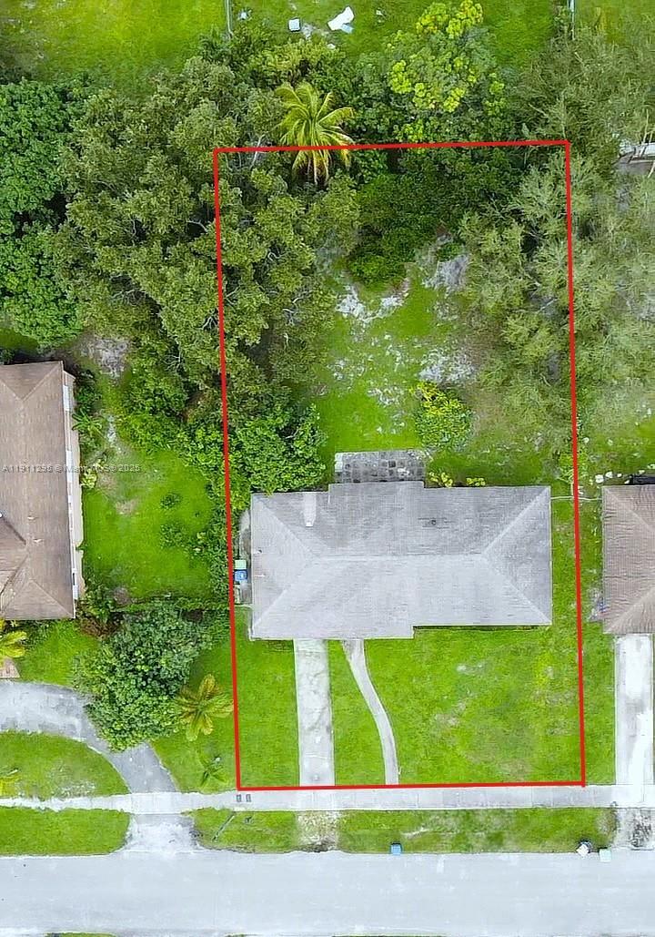 1041 Northwest 150th Street Miami, FL 33168 - Photo 4 of 27 a view of a yard with an house