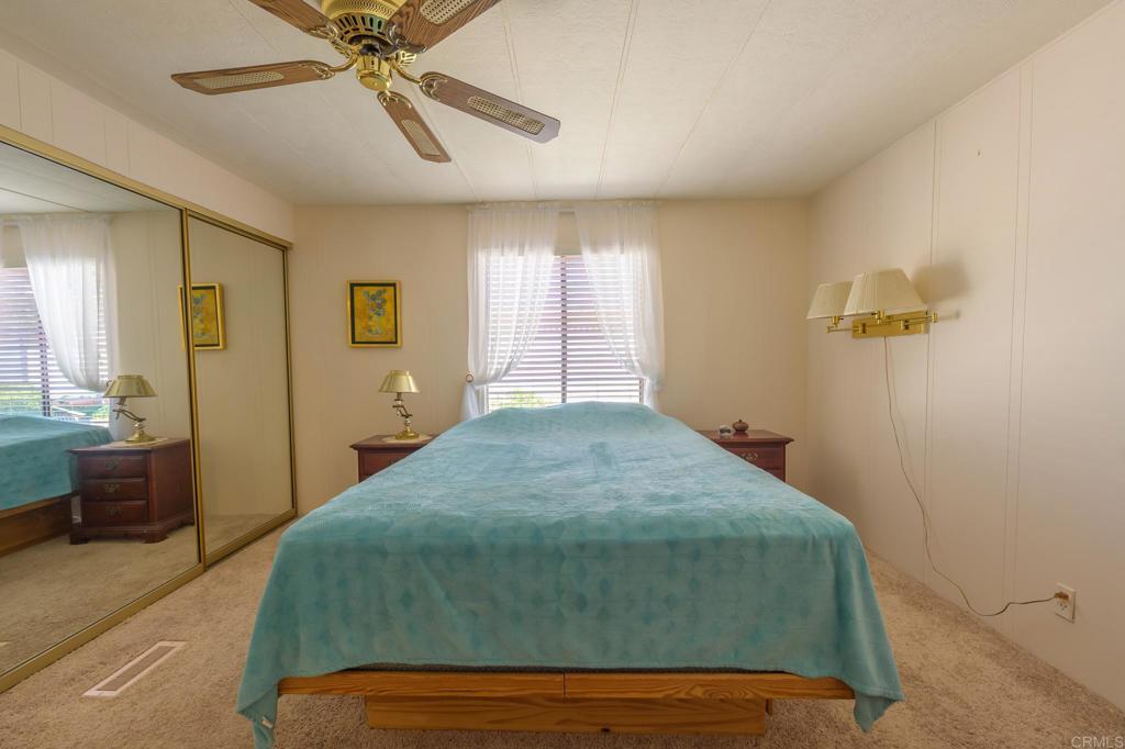 4650 Dulin Road, Unit 120 Fallbrook, CA 92003 - Photo 11 of 34 a bedroom with a bed and window