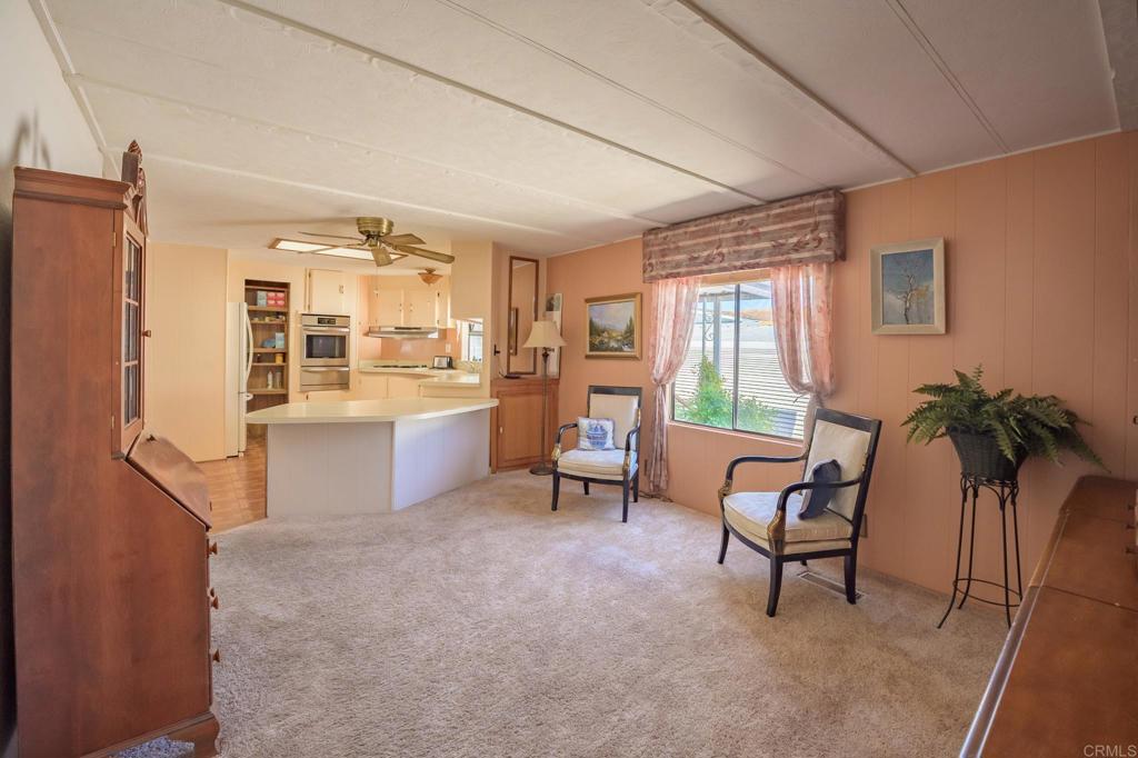 4650 Dulin Road, Unit 120 Fallbrook, CA 92003 - Photo 15 of 34 a living room with furniture and a large window