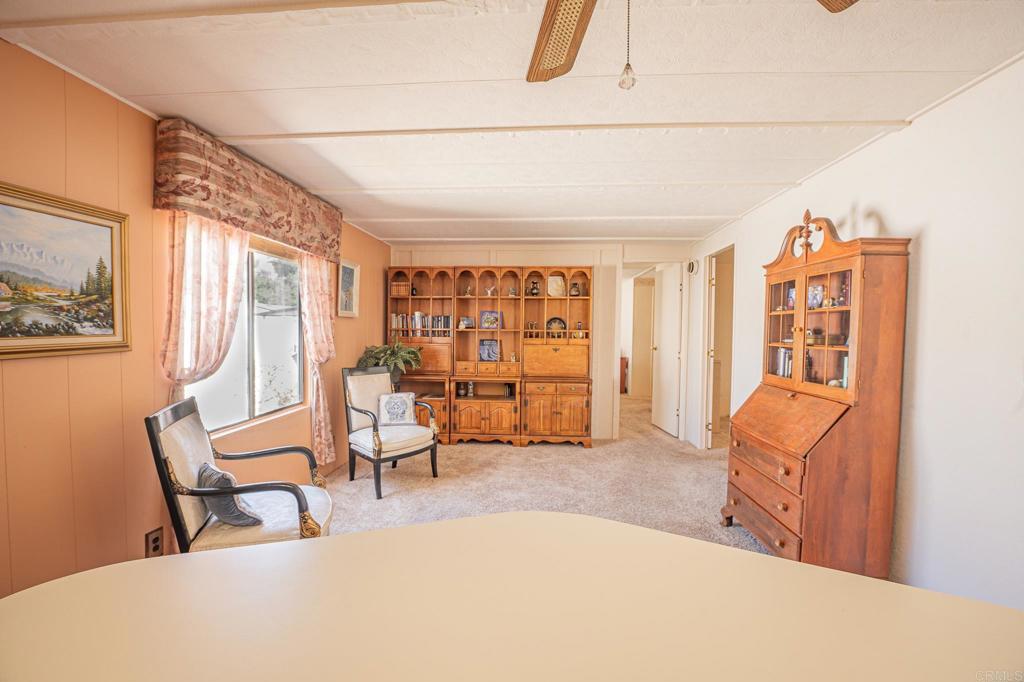 4650 Dulin Road, Unit 120 Fallbrook, CA 92003 - Photo 17 of 34 a living room with furniture and a large window