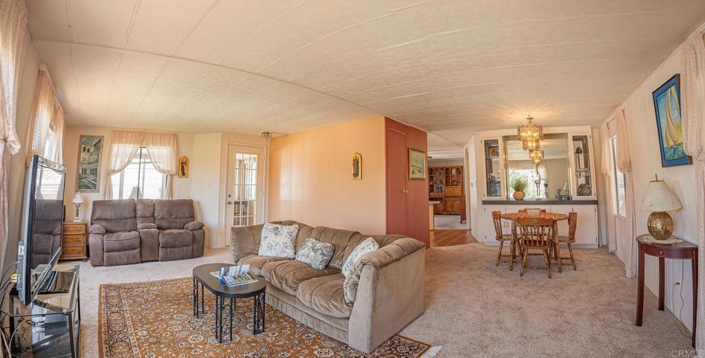 4650 Dulin Road, Unit 120 Fallbrook, CA 92003 - Photo 20 of 34 a living room with furniture and a large window