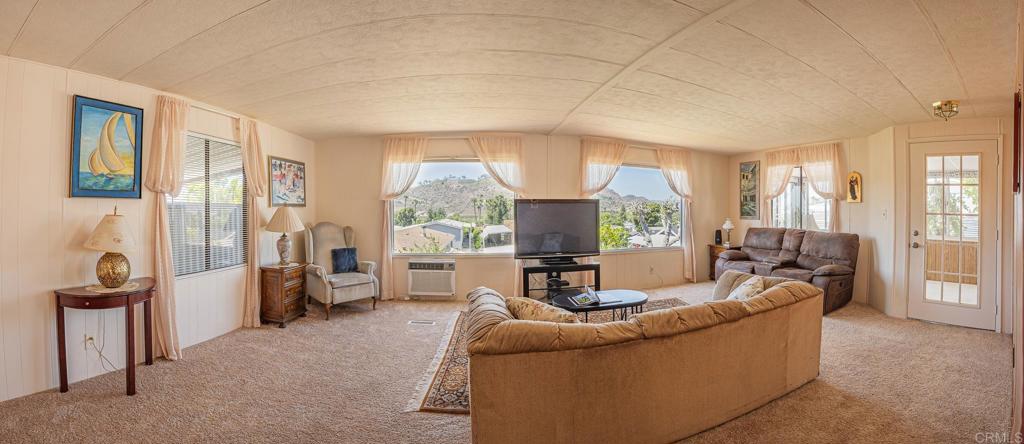 4650 Dulin Road, Unit 120 Fallbrook, CA 92003 - Photo 22 of 34 a living room with furniture and a large window