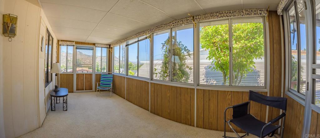 4650 Dulin Road, Unit 120 Fallbrook, CA 92003 - Photo 7 of 34 a view of a room with a large window and wooden floor