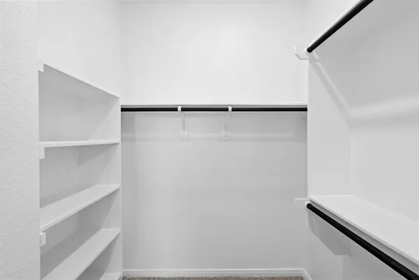 a view of an empty walk in closet