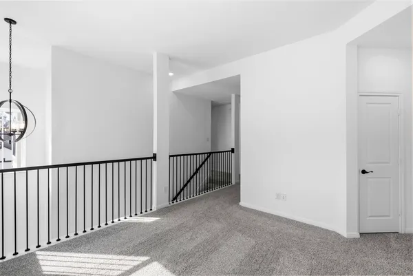 a view of a hallway with a window