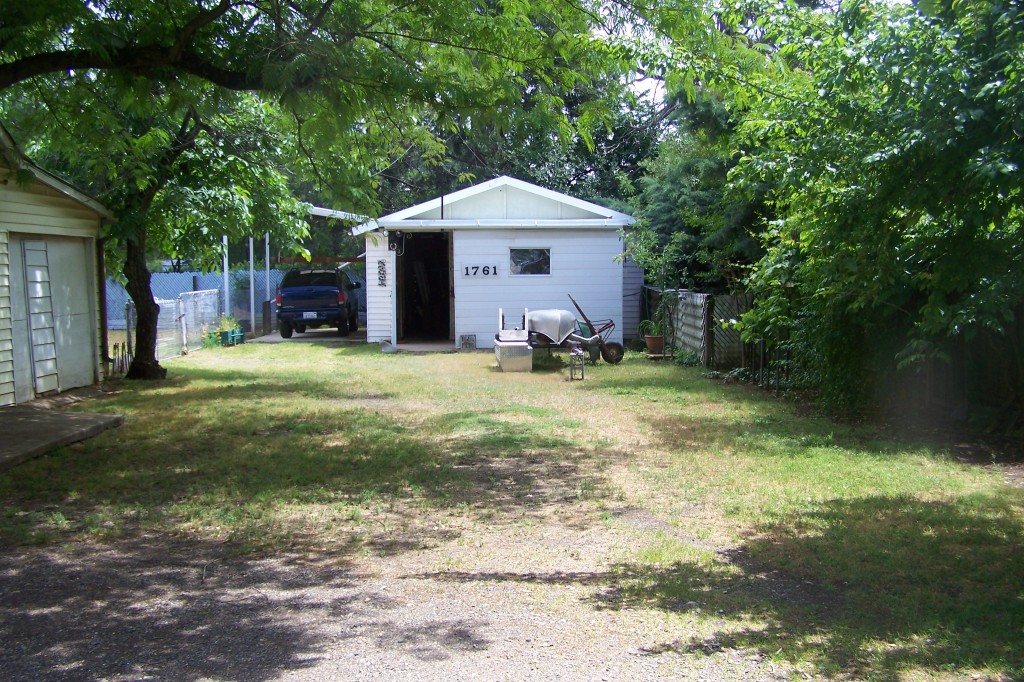 1761 Canby Road Redding, CA 96002 - Photo 3 of 10 a front view of a house with a yard