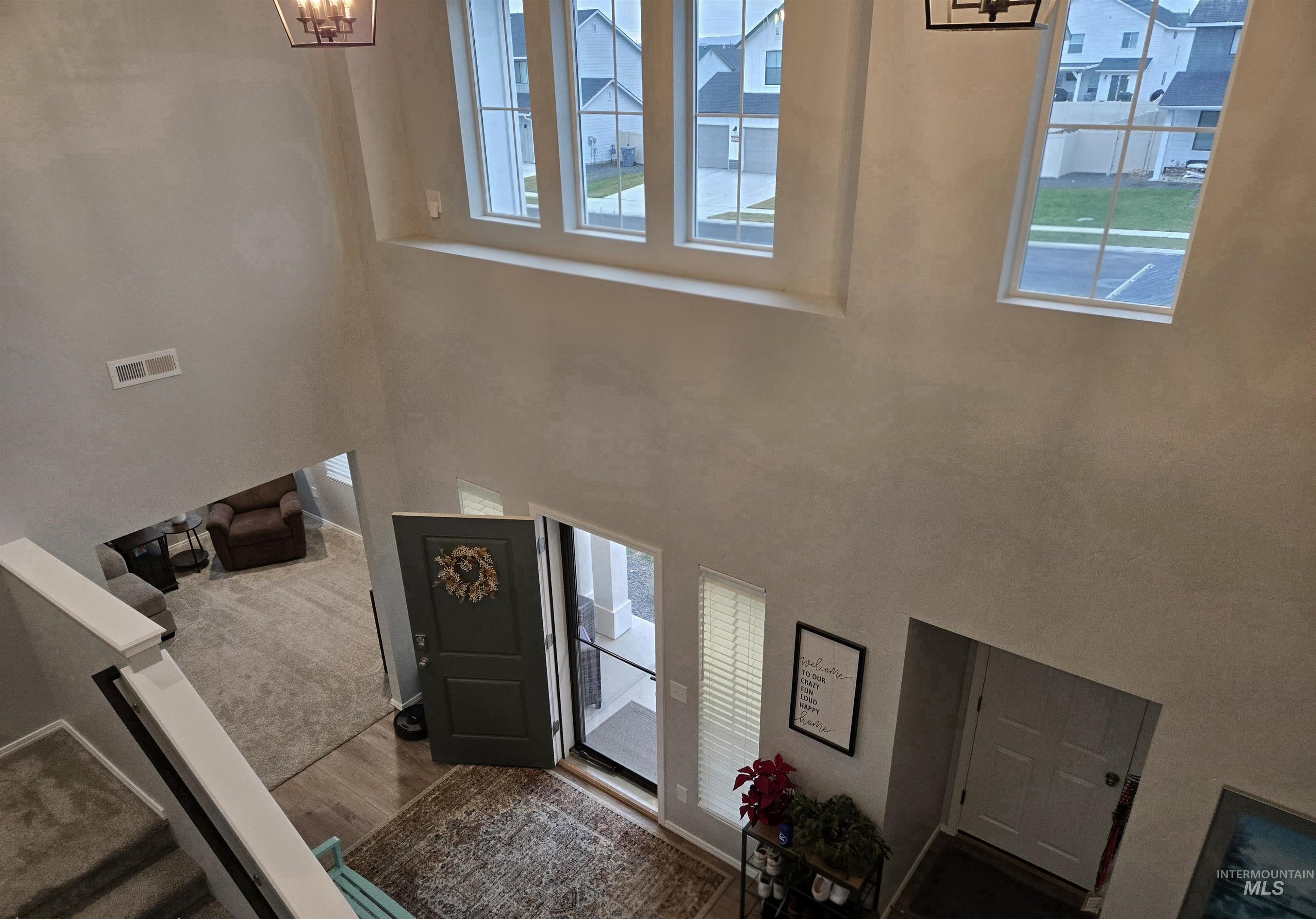 4098 East Mets Street Nampa, ID 83686 - Photo 25 of 34 Entrance foyer featuring wood finished floors and a high ceiling