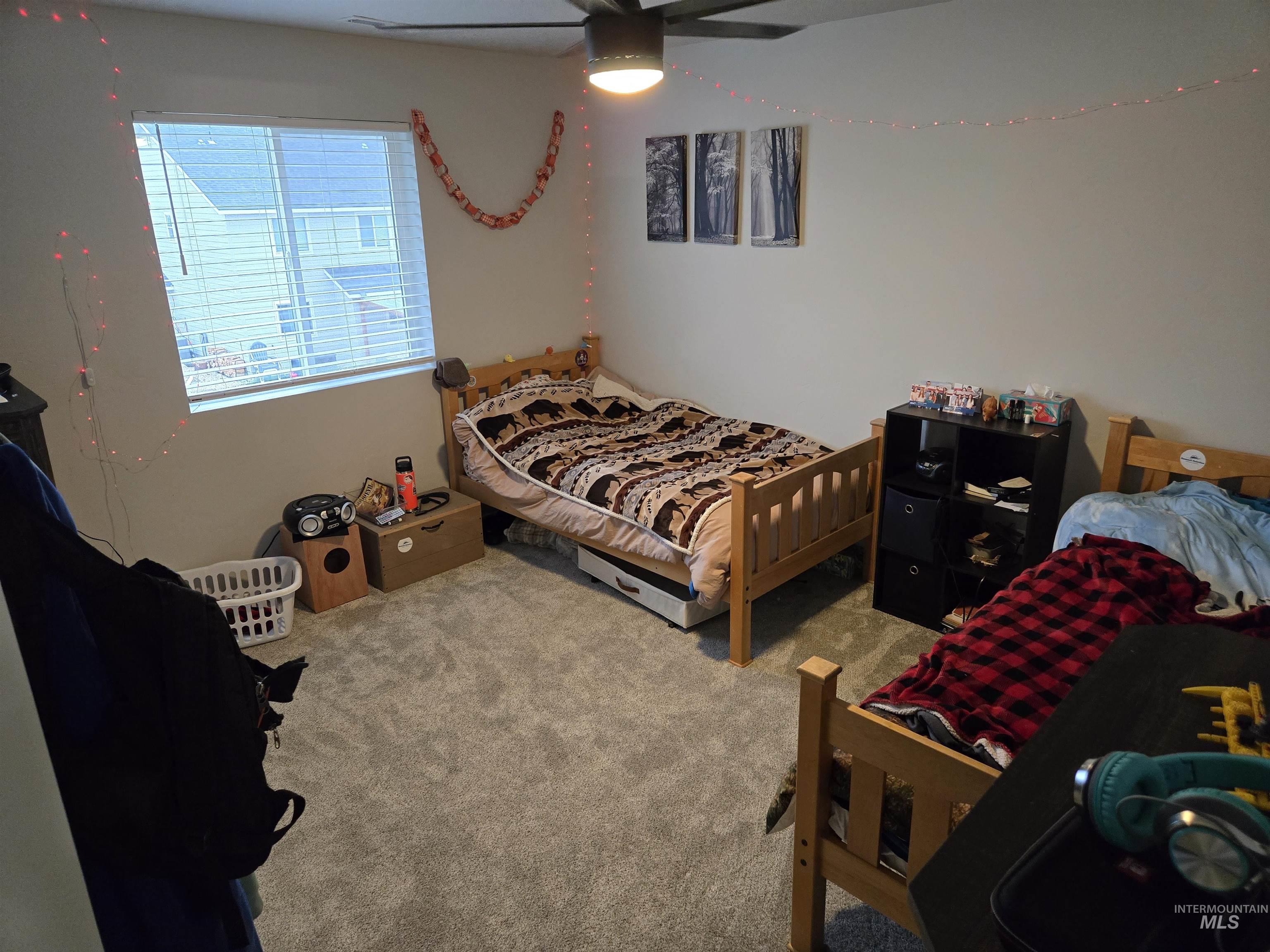 4098 East Mets Street Nampa, ID 83686 - Photo 29 of 34 Bedroom with carpet and a ceiling fan