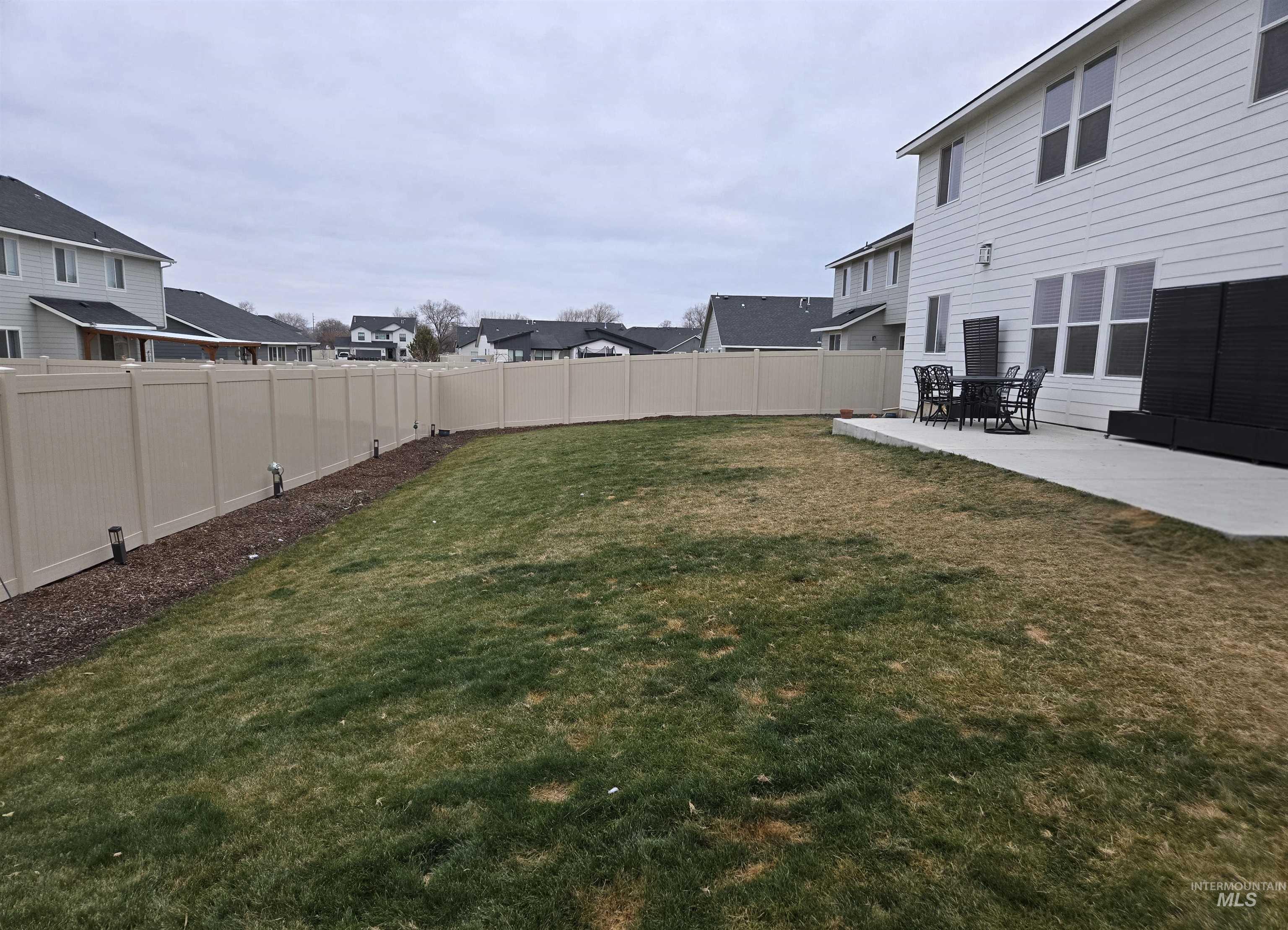 4098 East Mets Street Nampa, ID 83686 - Photo 32 of 34 Fenced backyard featuring a patio area and a residential view