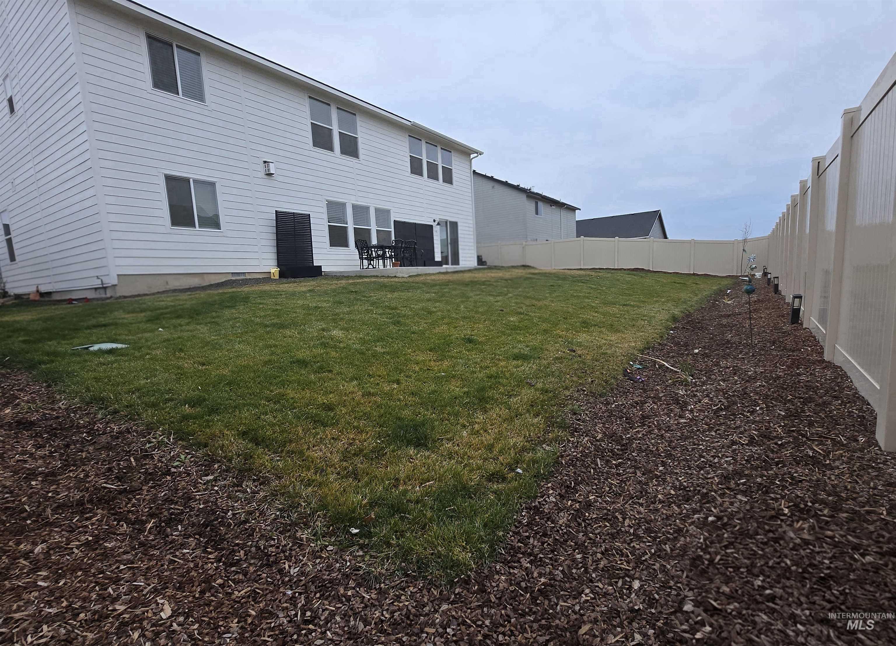 4098 East Mets Street Nampa, ID 83686 - Photo 33 of 34 Rear view of property with a patio area and a fenced backyard