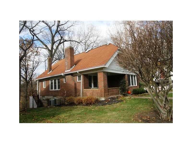 443 Walnut Road Pittsburgh, PA 15202 - Photo 24 of 25 Exterior Front. Side view of the home with a view of the covered front porch. The bricks are in fantastic shape.