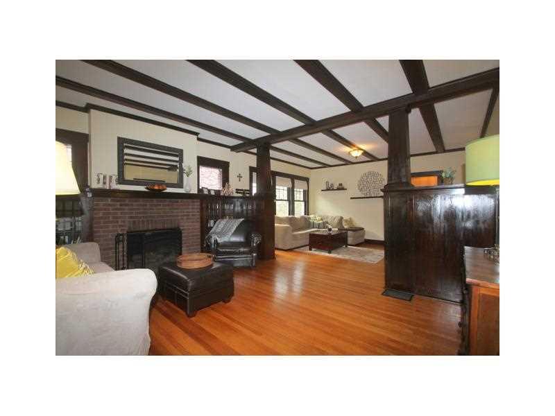 443 Walnut Road Pittsburgh, PA 15202 - Photo 4 of 25 Family Room. View from the Family Room to the Living Room highlights the gorgeous original oak floors and the beams and unique built in wood work on the main level of the home.