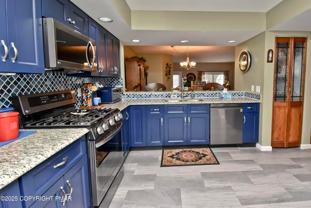 a kitchen with a stove and a sink