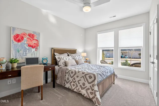 a bedroom with a bed and a bathroom