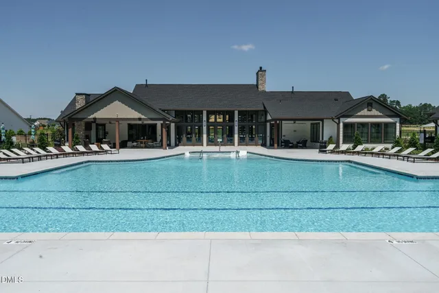 a view of a patio with couches and a fire pit